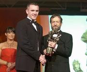 26 November 2004; Martin McGrath of Fermanagh, is presented with his All-Star award by Sean Kelly, President of the GAA, at the 2004 Vodafone GAA All-Star Awards. Citywest, Dublin. Picture credit; Brendan Moran / SPORTSFILE