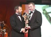 26 November 2004; Damien Fitzhenry of Wexford, is presented with his All-Star award by Sean Kelly, President of the GAA, at the 2004 Vodafone GAA All-Star Awards. Citywest, Dublin. Picture credit; Brendan Moran / SPORTSFILE