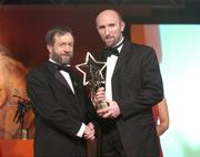 26 November 2004; Brian Corcoran of Cork, is presented with his All-Star award by Sean Kelly, President of the GAA, at the 2004 Vodafone GAA All-Star Awards. Citywest, Dublin. Picture credit; Brendan Moran / SPORTSFILE