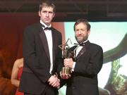 26 November 2004; Enda Muldoon of Derry, is presented with his All-Star award by Sean Kelly, President of the GAA, at the 2004 Vodafone GAA All-Star Awards. Citywest, Dublin. Picture credit; Brendan Moran / SPORTSFILE