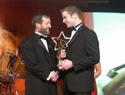 26 November 2004; JJ Delaney of Kilkenny, is presented with his All-Star award by Sean Kelly, President of the GAA, at the 2004 Vodafone GAA All-Star Awards. Citywest, Dublin. Picture credit; Brendan Moran / SPORTSFILE