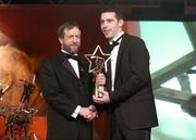 26 November 2004; Ronan Curran of Cork, is presented with his All-Star award by Sean Kelly, President of the GAA, at the 2004 Vodafone GAA All-Star Awards. Citywest, Dublin. Picture credit; Brendan Moran / SPORTSFILE