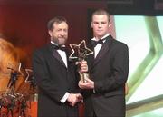 26 November 2004; Tommy Walsh of Kilkenny, is presented with his All-Star award by Sean Kelly, President of the GAA, at the 2004 Vodafone GAA All-Star Awards. Citywest, Dublin. Picture credit; Brendan Moran / SPORTSFILE