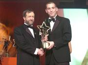 26 November 2004; Ken McGrath of Waterford, is presented with his All-Star award by Sean Kelly, President of the GAA, at the 2004 Vodafone GAA All-Star Awards. Citywest, Dublin. Picture credit; Brendan Moran / SPORTSFILE