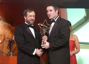 26 November 2004; Eoin Kelly of Tipperary, is presented with his All-Star award by Sean Kelly, President of the GAA, at the 2004 Vodafone GAA All-Star Awards. Citywest, Dublin. Picture credit; Brendan Moran / SPORTSFILE
