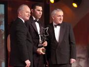 26 November 2004; Sean Og O hAilpin of Cork, is presented with the Hurler of the Year by An Taoiseach Bertie Ahern TD, in the company of Paul Donovan, Chief Executive, Vodafone Ireland, at the 2004 Vodafone GAA All-Star Awards. Citywest, Dublin. Picture credit; Ray McManus / SPORTSFILE