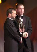 26 November 2004; Ken McGrath of Waterford, is presented with his All-Star award by Sean Kelly, President of the GAA, at the 2004 Vodafone GAA All-Star Awards. Citywest, Dublin. Picture credit; Ray McManus / SPORTSFILE