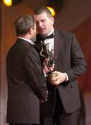 26 November 2004; Diarmuid O'Sullivan of Cork, is presented with his All-Star award by Sean Kelly, President of the GAA, at the 2004 Vodafone GAA All-Star Awards. Citywest, Dublin. Picture credit; Ray McManus / SPORTSFILE