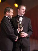26 November 2004; JJ Delaney of Kilkenny, is presented with his All-Star award by Sean Kelly, President of the GAA, at the 2004 Vodafone GAA All-Star Awards. Citywest, Dublin. Picture credit; Ray McManus / SPORTSFILE