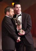 26 November 2004; Ronan Curran of Cork, is presented with his All-Star award by Sean Kelly, President of the GAA, at the 2004 Vodafone GAA All-Star Awards. Citywest, Dublin. Picture credit; Ray McManus / SPORTSFILE