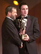 26 November 2004; Eoin Kelly of Tipperary, is presented with his All-Star award by Sean Kelly, President of the GAA, at the 2004 Vodafone GAA All-Star Awards. Citywest, Dublin. Picture credit; Ray McManus / SPORTSFILE