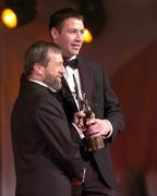 26 November 2004; Dan Shanahan of Waterford, is presented with his All-Star award by Sean Kelly, President of the GAA, at the 2004 Vodafone GAA All-Star Awards. Citywest, Dublin. Picture credit; Ray McManus / SPORTSFILE