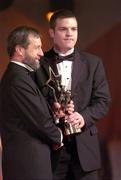 26 November 2004; Niall McCarthy of Cork, is presented with his All-Star award by Sean Kelly, President of the GAA, at the 2004 Vodafone GAA All-Star Awards. Citywest, Dublin. Picture credit; Ray McManus / SPORTSFILE