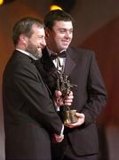 26 November 2004; Paul Fynn of Waterford, is presented with his All-Star award by Sean Kelly, President of the GAA, at the 2004 Vodafone GAA All-Star Awards. Citywest, Dublin. Picture credit; Ray McManus / SPORTSFILE