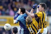 28 November 2004; Eoghan Woods, Mayobridge, in action against Stephen Clarke, no.8, and Colm O'Neill, Crossmaglen Rangers. AIB Ulster Club Senior Football Final, Crossmaglen Rangers v Mayobridge, Casement Park, Belfast. Picture credit; David Maher / SPORTSFILE