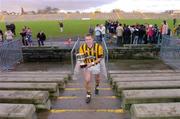 28 November 2004; Tony McEntee, Crossmaglen Rangers captain, walks back to his dressing room holding the Ulster Club trophy, after victory over Mayobridge. AIB Ulster Club Senior Football Final, Crossmaglen Rangers v Mayobridge, Casement Park, Belfast. Picture credit; David Maher / SPORTSFILE