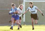 28 November 2004; Karen Hopkins, Ballyboden St. Enda's, in action against Hanora Kelleher and Rena Buckley, left, Donaghmore. AIB Ladies Club All-Ireland Senior Football Final, Donaghmore v Ballyboden St. Enda's, St. Brendan's Park, Birr, Co. Offaly. Picture credit; Pat Murphy / SPORTSFILE