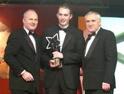 26 November 2004; Niall Tinney of Fermanagh, is presented with the Young Footballer of the Year by Paul Donovan, left, Chief Executive, Vodafone Ireland, and An Taoiseach Bertie Ahern TD, at the 2004 Vodafone GAA All-Star Awards. Citywest, Dublin. Picture credit; Brendan Moran / SPORTSFILE