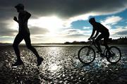 30 November 2004; Olympic rower Gearoid Towey, left, and Olympic mountain biker Tarja Owens on Sandymount beach as they make final preparations before heading off to compete in a unique international sports event 'Red Bull Giants of Rio' in Rio De Janeiro, Brazil, on Sunday 5th December. Sandymount Beach, Dublin. Picture credit; David Maher / SPORTSFILE