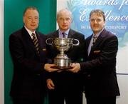 30 November 2004; Dunlop National Rally Champion Niall Maguire, left, and Co-Driver Paul McLaughlin, right, are presented with the Vard Memorial Trophy by Richard Warbrick, Dunlop, at the Alfa Romeo / Motorsport Ireland Awards for Excellence in Irish Motorsport 2004. Conrad Hotel, Dublin. Picture credit; Pat Murphy / SPORTSFILE