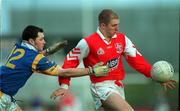 7 February 1999; Aaron Hoey of Louth is tackled by Trevor Doyle of Wicklow during the Church and General National Football League Division 2A match between Louth and Wicklow at O'Rahilly Park in Drogheda, Louth. Photo by Brendan Moran/Sportsfile