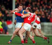 7 February 1999; Barry O'Donovan of Wicklow is tackled by Alan Rooney of Louth during the National Football League match between Louth and Wicklow at O'Rahilly Park in Drogheda, Louth. Photo by Brendan Moran/Sportsfile