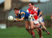 7 February 1999; Barry O'Donovan of Wicklow is tackled by Seamus O'Hanlon of Louth during the National Football League match between Louth and Wicklow at O'Rahilly Park in Drogheda, Louth. Photo by Brendan Moran/Sportsfile