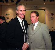 20 January 1999; Republic of Ireland Manager Mick McCarthy shakes hands with FAI Technical Director and Youth team Manager Brian Kerr at the announcement of The Arena, Ireland's first ever multifunctional all seater venue. The Arena will have a 45,000 capacity, and will be built at Citywest, Dublin. The announcement was at the Burlington Hotel in Dublin. Photo by David Maher/Sportsfile
