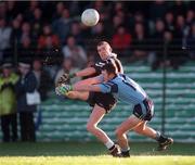 20 December 1998; Brian Shanahan of Doonbeg shoots for a score despite the tackle of Noel Wall of Moyle Rovers during the AIB Munster Senior Club Football Championship Final Replay match between Doonbeg and Moyle Rovers at the Gaelic Grounds in Limerick. Photo by Ray McManus/Sportsfile
