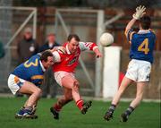 7 February 1999; Cathal O'Hanlon of Louth shoots for a score despite the attention of Hugh Kenny, left, and Mark Coffey of Wicklow during the Church and General National Football League Division 2A match between Louth and Wicklow at O'Rahilly Park in Drogheda, Louth. Photo by Brendan Moran/Sportsfile