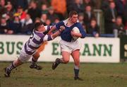 11 March 1998; Colm McWeeney of St Mary's escapes the tackle of Henry Burke of Clongowes Wood College during the Leinster Senior Cup Semi-Final match between St Mary's College and Clongowes Wood College at Donnybrook Stadium in Dublin. Photo by Matt Browne/Sportsfile