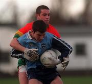 16 January 1999; Colm Moran of Dublin is tackled by Joe Byrne of Carlow during the O'Byrne Cup Quarter-Final match between Carlow and Dublin at Dr Cullen Park in Carlow. Photo by Aoife Rice/Sportsfile