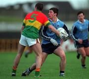 16 January 1999; Colm Moran of Dublin in action against Joe Byrne of Carlow during the O'Byrne Cup Quarter-Final match between Carlow and Dublin at Dr Cullen Park in Carlow. Photo by Ray McManus/Sportsfile