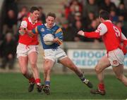 7 February 1999;  Damien McMahon ofWicklow in action against Gareth O'Neill, left, and Ken Reilly of Louth during the National Football League match between Louth and Wicklow at O'Rahilly Park in Drogheda, Louth. Photo by Brendan Moran/Sportsfile