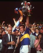 21 July 1991; Declan Carr of Tipperary lifts the Munster Cup following the Munster Senior Hurling Championship Final Replay match between Tipperary and Cork at Semple Stadium in Thurles, Tipperary. Photo by Ray McManus/Sportsfile