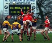 31 January 1999; Jody Morrisey, right, and Tom Nolan, centre, of Éire Og in action against Conor Deegan of Kilmacud Crokes during the AIB Leinster Club Football Championship Final 2nd Replay match between Éire Og and Kilmacud Crokes at St Conleths Park in Newbridge, Kildare. Photo by Aoife Rice/Sportsfile