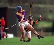 7 February 1999; Eugene Furlong of Wexford in action against Brendan Ryan of Kilkenny during the Walsh Cup Semi-Final match between Kilkenny and Wexford in Mullinavat in Kilkenny. Photo by Ray McManus/Sportsfile