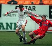 31 January 1999; Gareth Cronin of Cork City is tackled by Eoin Heery of Shelbourne during the Harp Lager National League Premier Division match between Shelbourne and Cork City at Tolka Park in Dublin. Photo by Matt Browne/Sportsfile