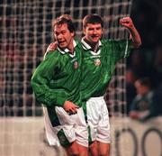 10 February 1999; Denis Irwin of Republic of Ireland, right, celebrates after scoring his side's first goal with team-mate Jason McAteer during the International Friendly match between Republic of Ireland and Paraguay at Lansdowne Road in Dublin. Photo by Ray McManus/Sportsfile