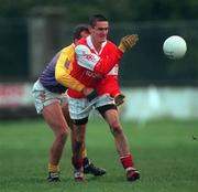 6 December 1998; Jody Morrissey of Éire Og in action against Mick Dillion of Kilmacud Crokes during the AIB Leinster Club Football Championship Final match between Éire Og and Kilmacud Crokes at St Conleth's Park in Newbridge, Kildare. Photo by Ray McManus/Sportsfile