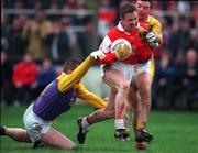 31 January 1999; Joe Murphy of Éire Og is tackled by Maurice Leahy of Kilmacud Crokes during the AIB Leinster Club Football Championship Final 2nd Replay match between Éire Og and Kilmacud Crokes at St Conleths Park in Newbridge, Kildare. Photo by Ray McManus/Sportsfile