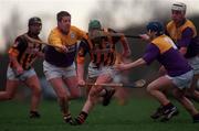 7 February 1999; Henry Shefflin of Kilkenny in action against Ger Cushe, left, Colm Kehoe and Darragh Ryan of Wexford during the Walsh Cup Semi-Final match between Kilkenny and Wexford in Mullinavat in Kilkenny. Photo by Ray McManus/Sportsfile