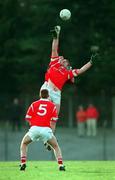 14 February 1999; Liam Honohan of Cork in action against Sean O'Domhnaill of Galway as Donagh Wiseman of Cork  looks on during the Church & General National Football League Division 1 match between Cork and Galway at Páirc Uí Rinn in Cork. Photo by Brendan Moran/Sportsfile
