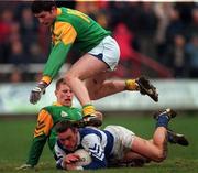 13 February 1999; Martin Delaney of Laois in action against Niall Kelly, right, Niall O'Reilly of Meath during the Leinster Under 21 Football Championship First Round Replay match between Laois and Meath at O'Moore Park in Portlaoise, Laois. Photo by Ray McManus/Sportsfile