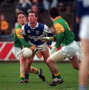13 February 1999; Martin Delaney Laois in action against Denis Kealy, right, and Nigel Crawford of Meath during the Leinster Under 21 Football Championship First Round Replay match between Laois and Meath at O'Moore Park in Portlaoise, Laois. Photo by Ray McManus/Sportsfile