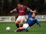 13 January 1999; Pakie Kelly of Cobh Ramblers is tackled by Sean Mulhall of Garda AFC during the Harp Lager FAI Cup First Round Replay match between Garda AFC and Cobh Ramblers at Westmanstown in Dublin. Photo by Matt Browne/SPORTSFILE.