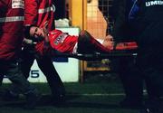 12 February 1999; Pat Fenlon of Shelbourne is stretchered off the pitch after a tackle from Paul Whelan of Shamrock Rovers during the Harp Lager National League Premier Division match between Shelbourne and Shamrock Rovers at Tolka Park in Dublin. Photo by David Maher/Sportsfile