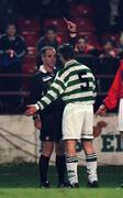 12 February 1999; Paul Whelan of Shamrock Rovers receives a red card from referee Tom Tully after fouling Pat Fenlon of Shelbourne during the Harp Lager National League Premier Division match between Shelbourne and Shamrock Rovers at Tolka Park in Dublin. Photo by David Maher/Sportsfile