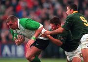 28 November 1998; Victor Costello of Ireland is tackled by Bobby Skinstad, centre, and Joost van der Westhuizen of South Africa during the International Rugby Friendly match between Ireland and South Africa at Lansdowne Road in Dublin. Photo by Brendan Moran/Sportsfile