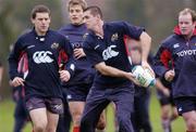 30 November 2004; Alan Quinlan prepares to pass the ball supported by team-mates, from left, Jason Holland, Shaun Payne and Frankie Sheahan during Munster rugby squad training. University of Limerick, Limerick. Picture credit; Damien Eagers / SPORTSFILE